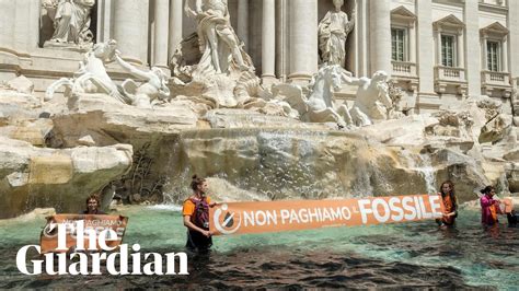 Trevi Fountain: Climate activists turn water in Rome 